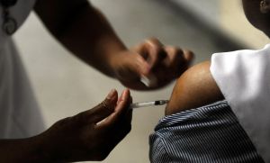 Nurse injecting a vaccine against the H1N1 or swine flu influenza at a hospital, Colombo, Sri Lanka