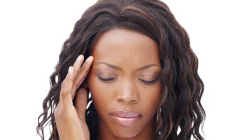 Cropped view of a pretty african american woman with a migraine