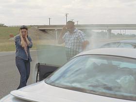 WS Man and woman exiting smoking cars after accident and looking at their damaged vehicles / Elmendorf, Texas, USA