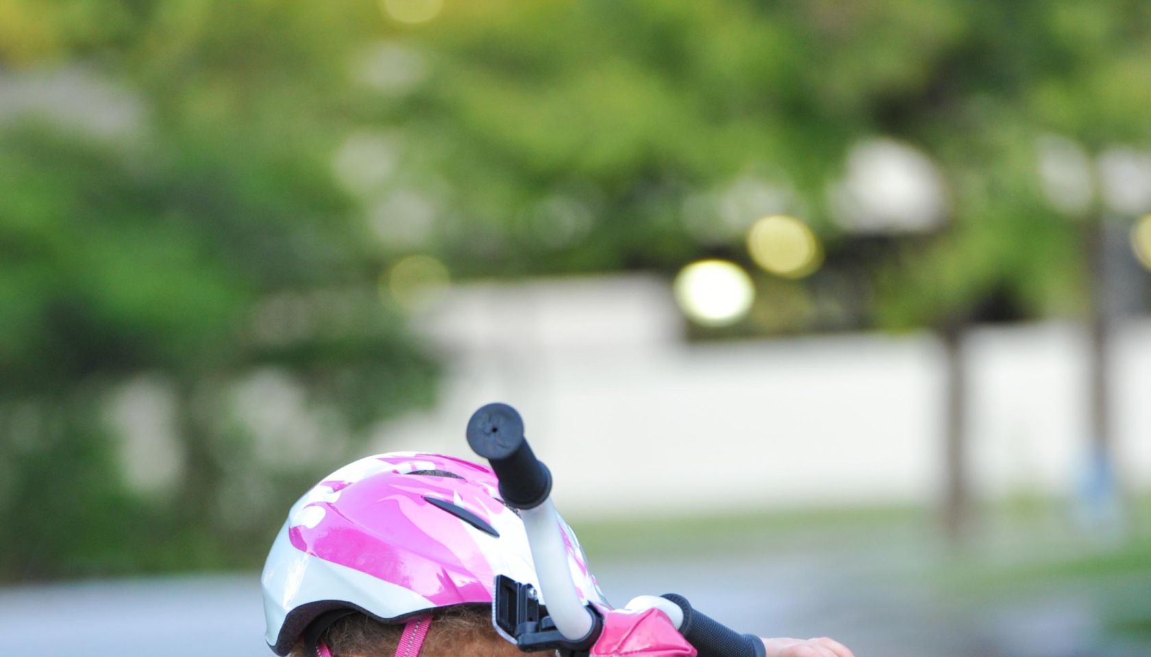 Girl, aged 3, fixes bicycle