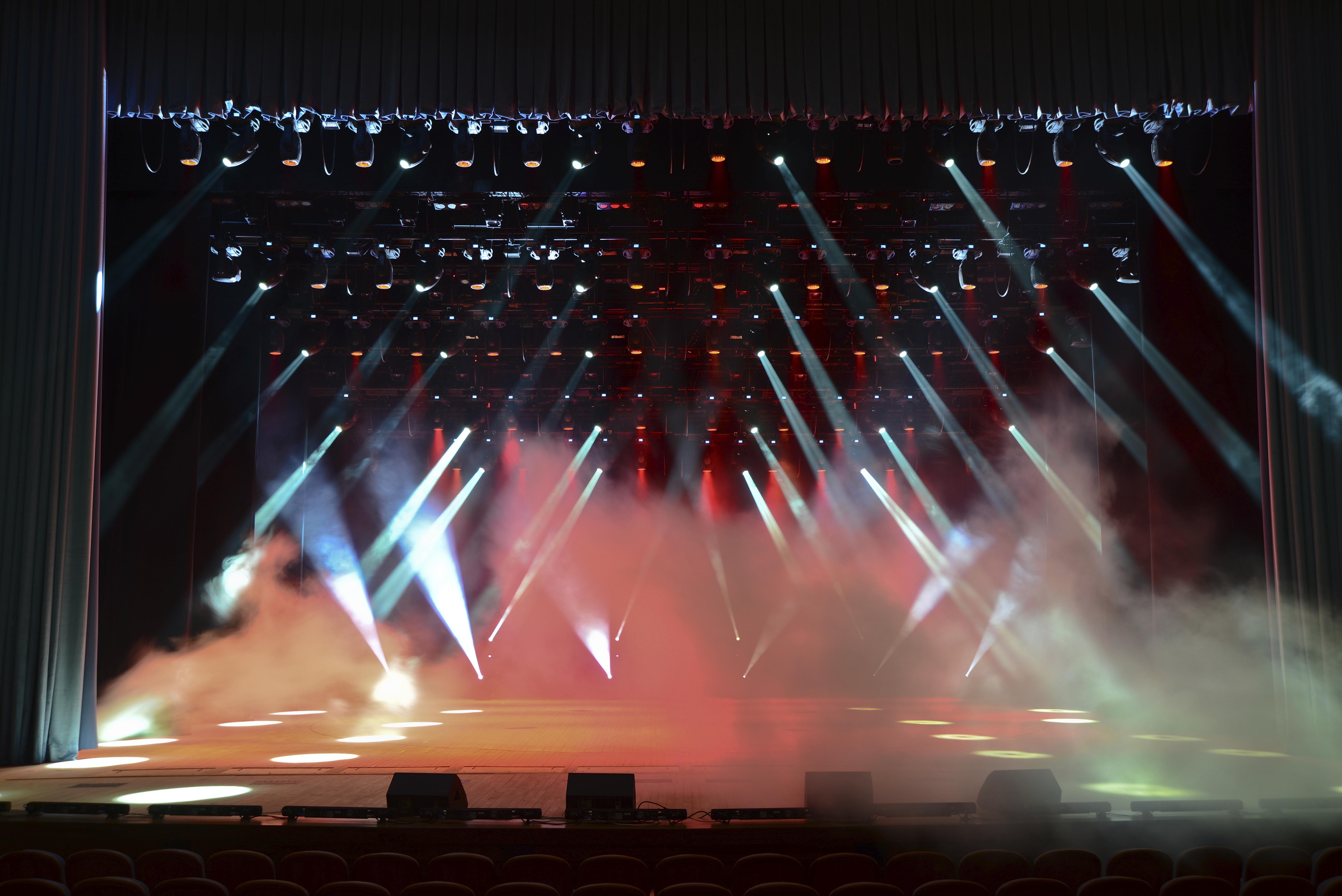 Illuminated empty concert stage with smoke