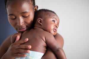 Close up of Black mother holding baby