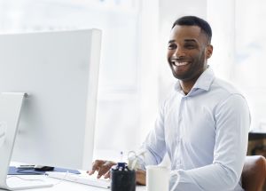 A handsome young african american businessman working at his desk