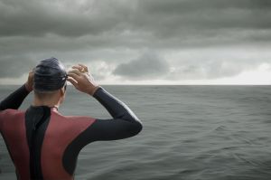 Swimmer looking out at ocean