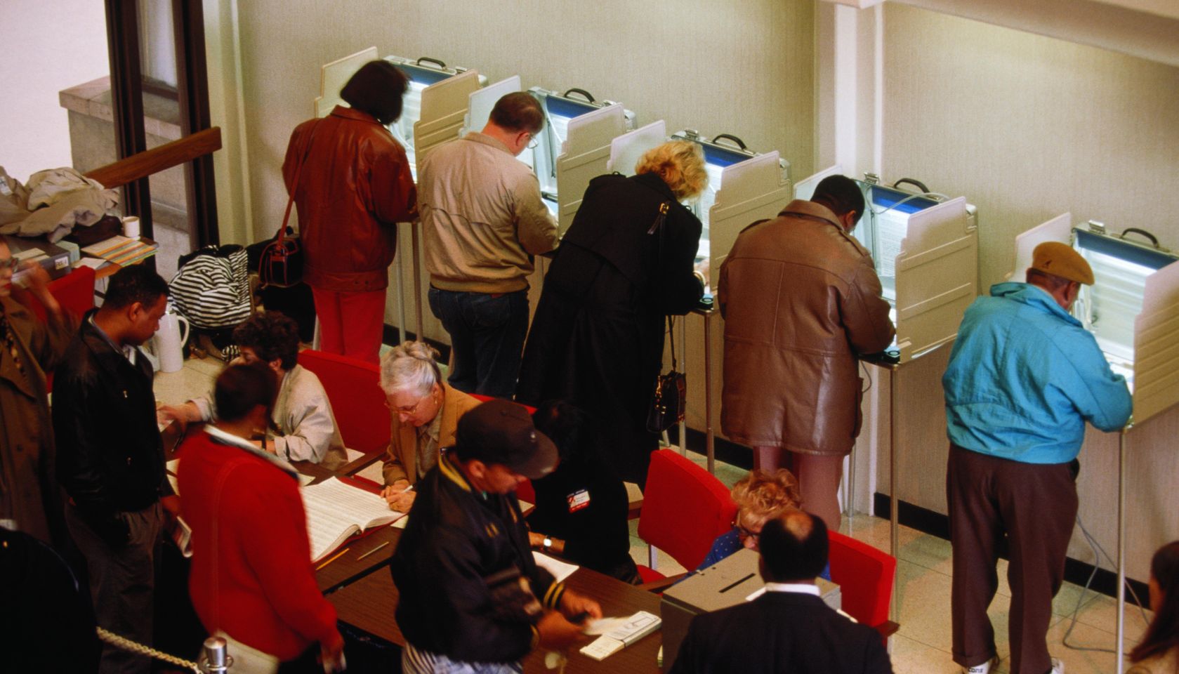 Voters in booths at election, elevated view