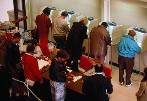 Voters in booths at election, elevated view