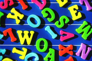 Directly Above Shot Of Colorful Alphabet On Blue Table