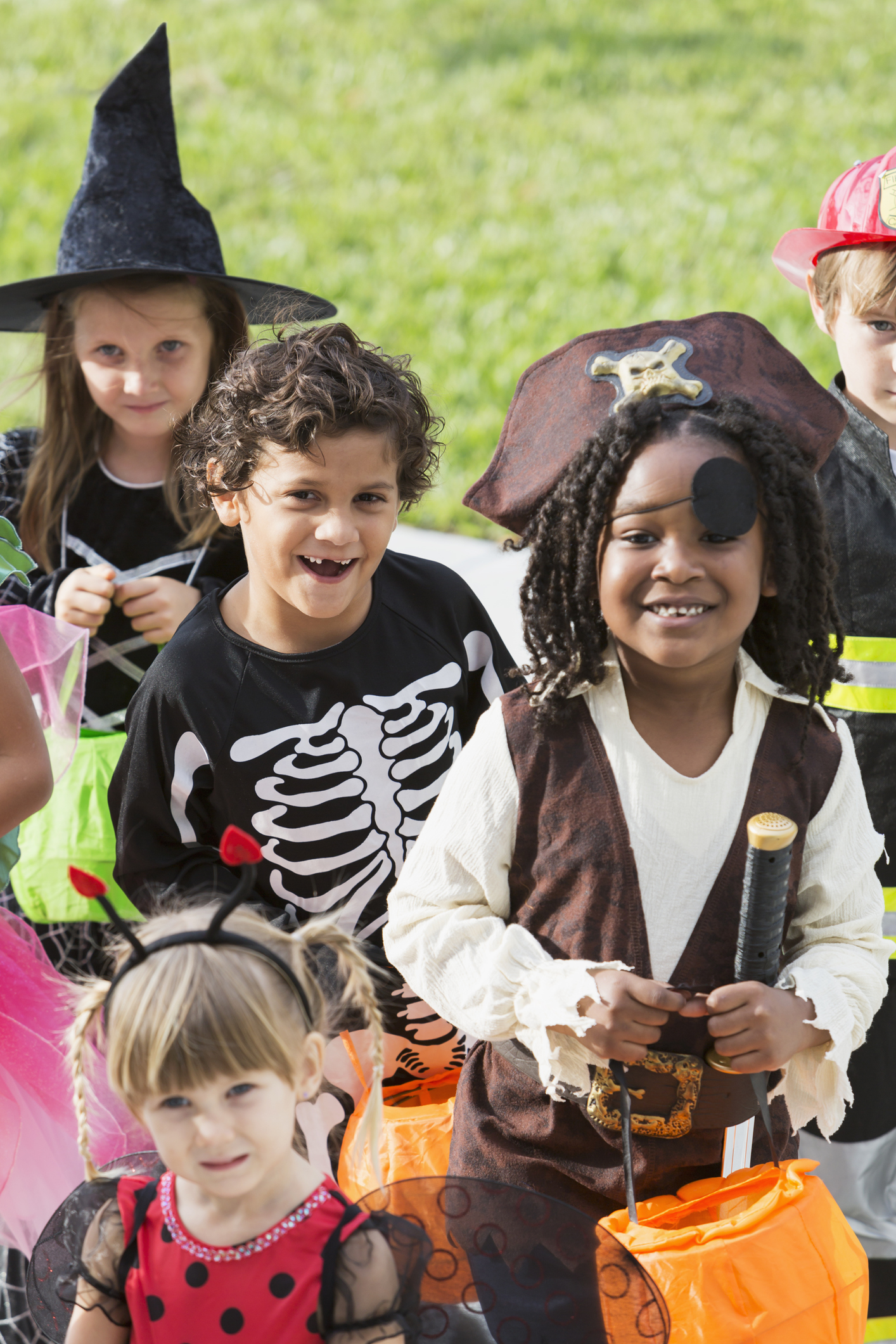 Multi-ethnic group of children in halloween costumes