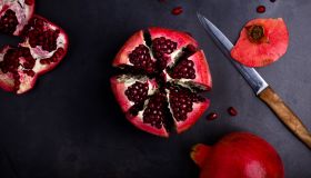 Ripe pomegranate fruit on vintage background