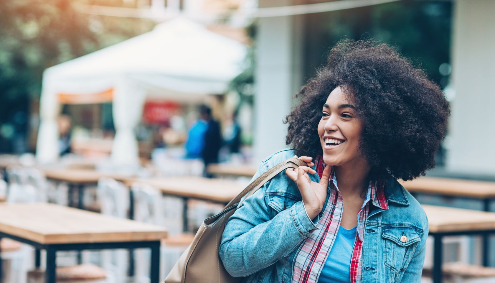 Beautiful smiling girl outdoors in the city