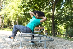 Workout in park on sit-up bench