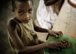 African Girl Eating a Meal in the Orphanage