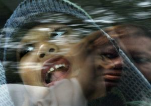 me/mom Saundra Adams (R) reflected on a car window and her 5-yrs-old grandson, Chancellor. Her daugh