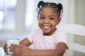 Little Girl Growing Strong Drinking Milk