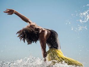Black woman dancing in water