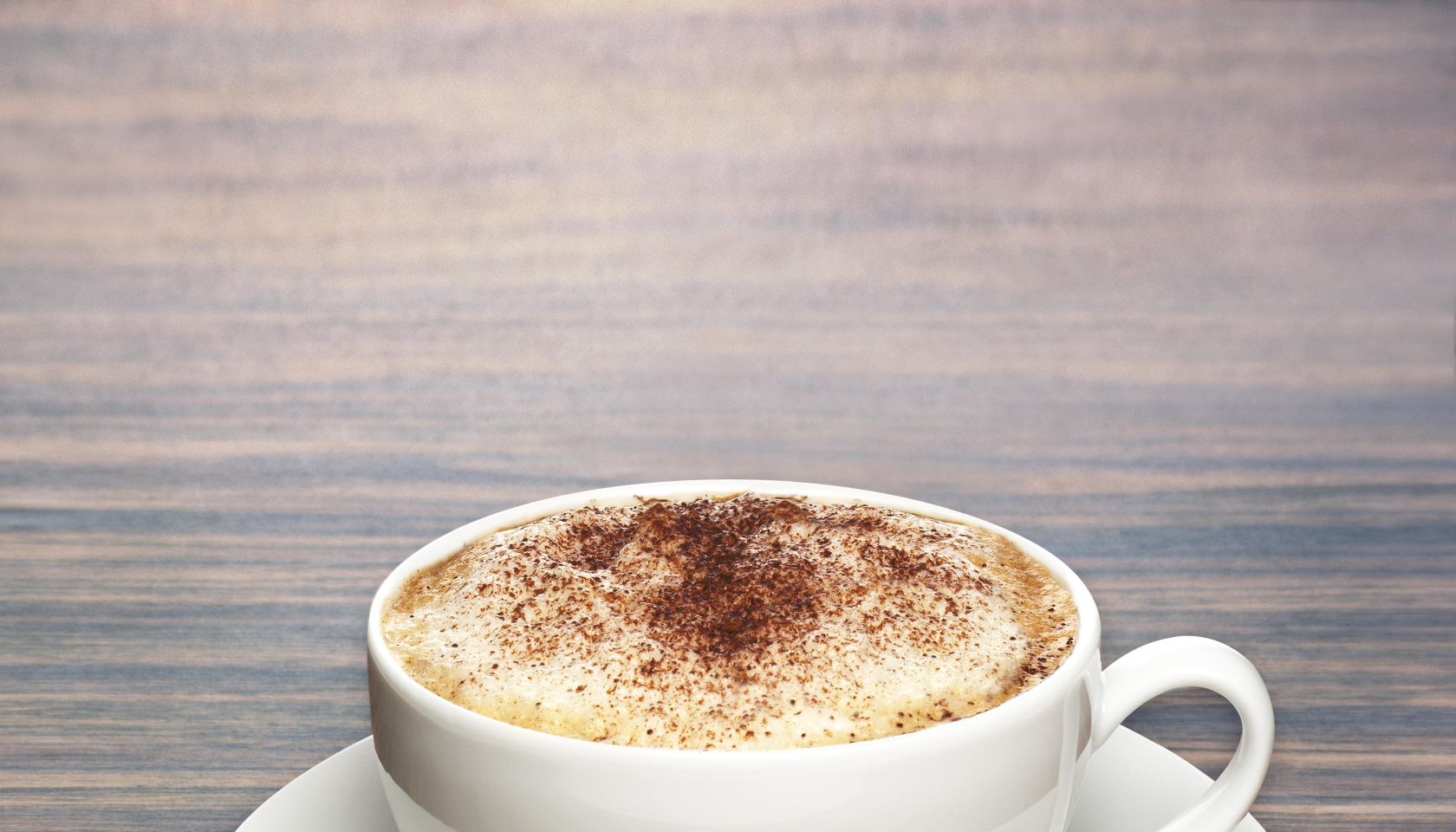 Coffee cup on wooden surface