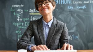 Pleased sophisticated female computer programmer