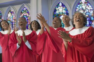African men and women in church choir singing