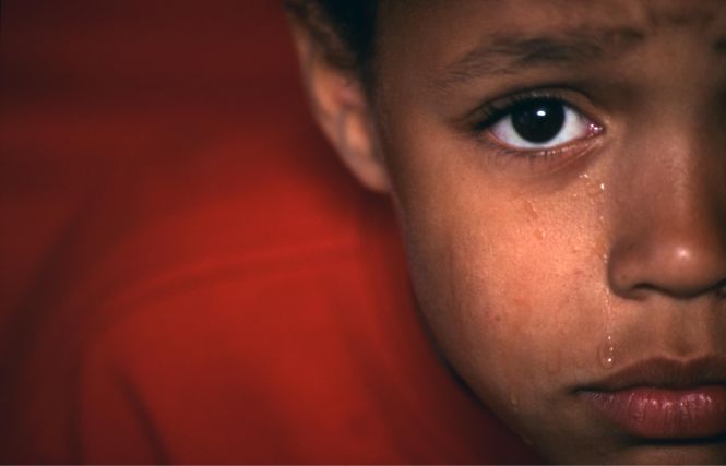 Close up of crying upset small boy,, UK