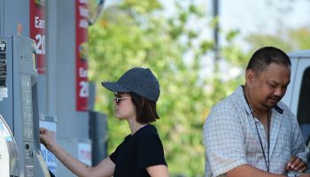 Lucy Hale fills up with gas