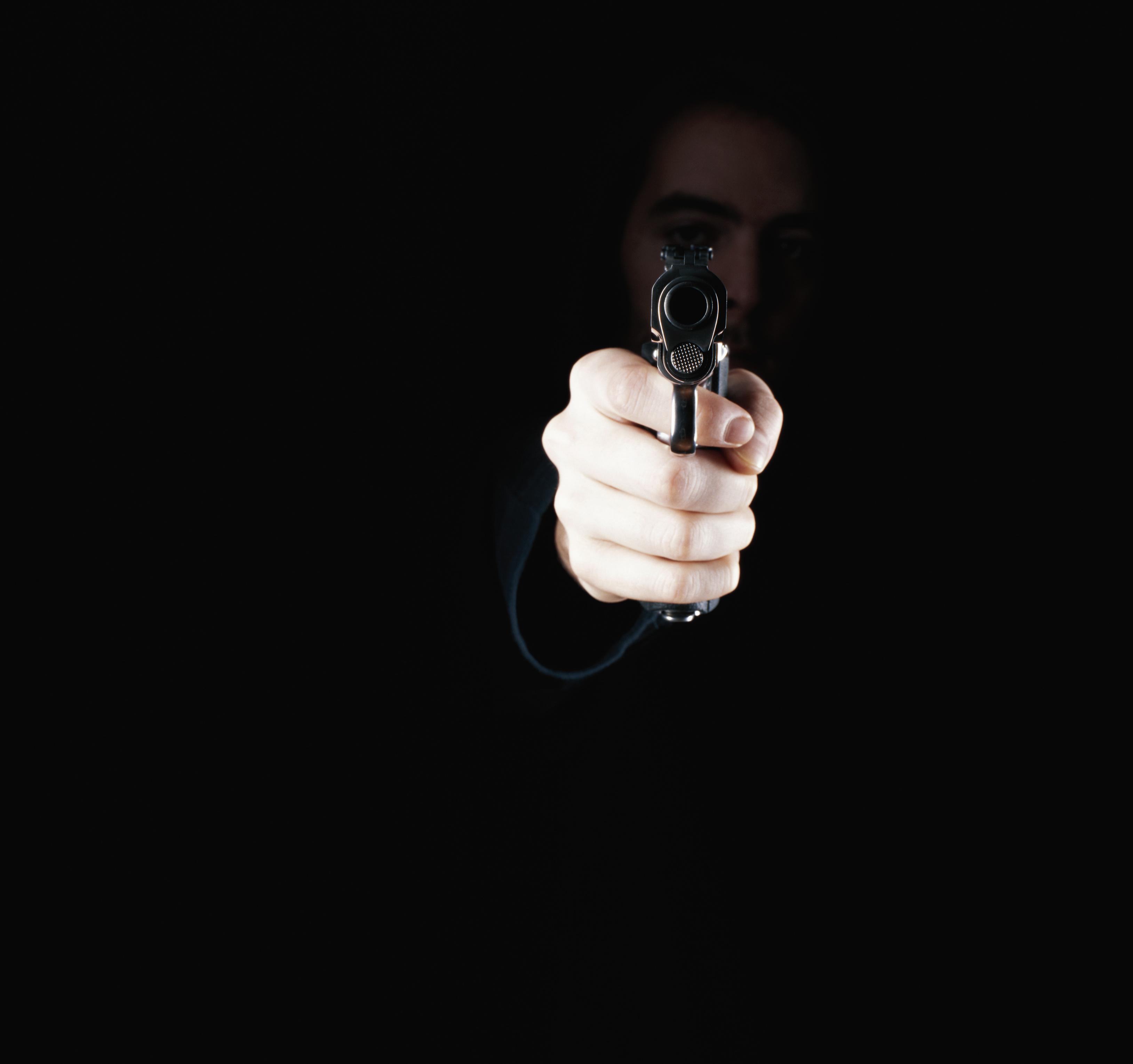 Man holding gun, close-up