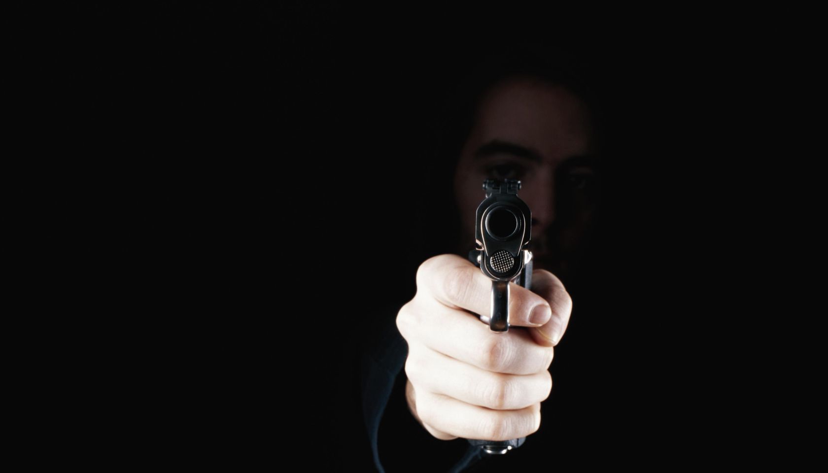 Man holding gun, close-up