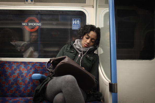 Woman sleeping on train