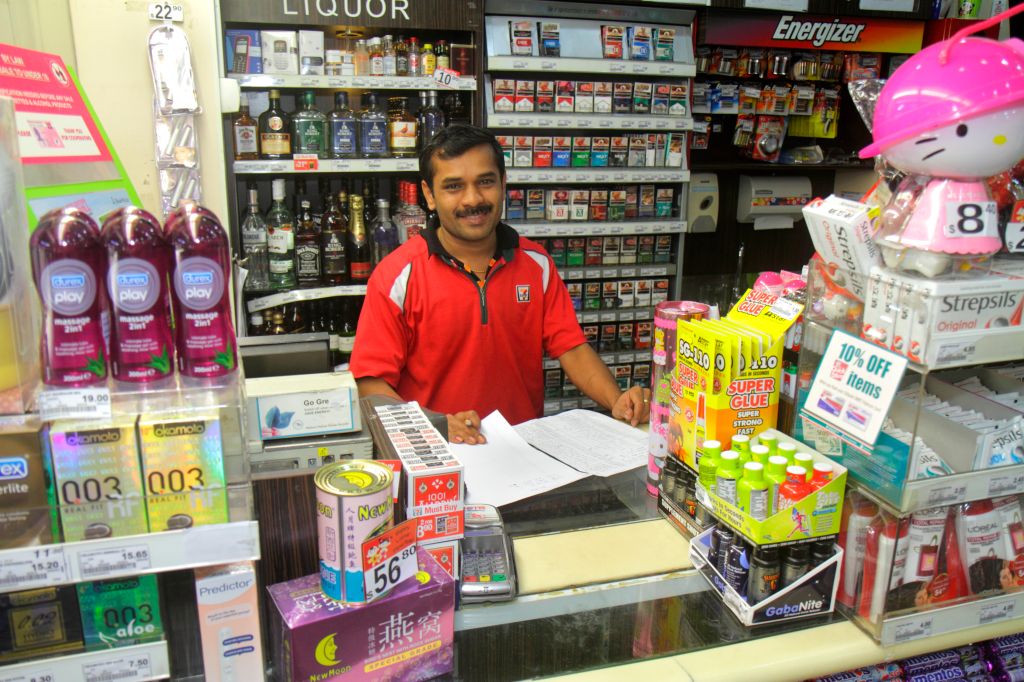 A cashier inside 7-Eleven.