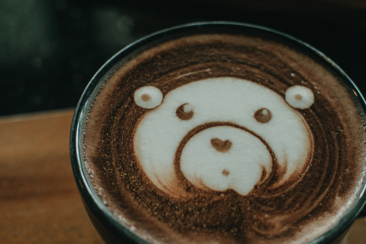 Cup Of Coffee Latte And Bear Face Bubble Aet On Wood Table