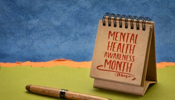 mental health awareness month, May - a note in a desktop calendar
