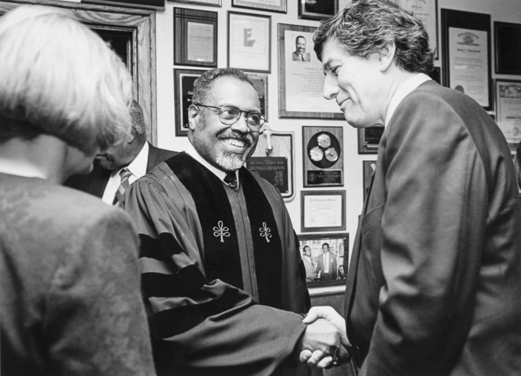 Rep. Bob Carr shaking hands with Charles G. Adams in Detroit, Michigan