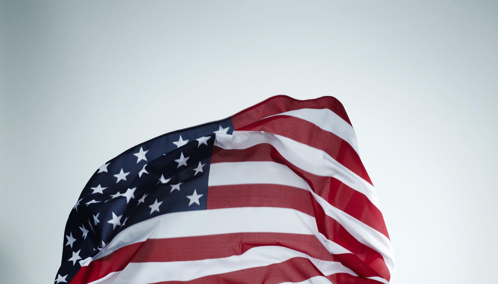 Hands holding American flag