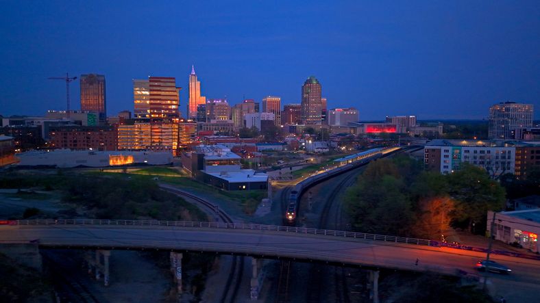 Train - Raleigh Skyline - Union Train Station - Boylan Bridge - Downtown - North Carolina - Sun Set Drone