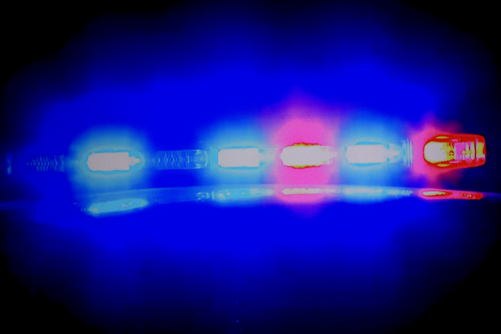 Cop car in pursuit on a night time scene