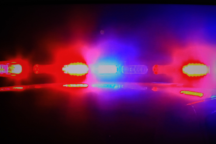 Flashing police car lights at a traffic stop