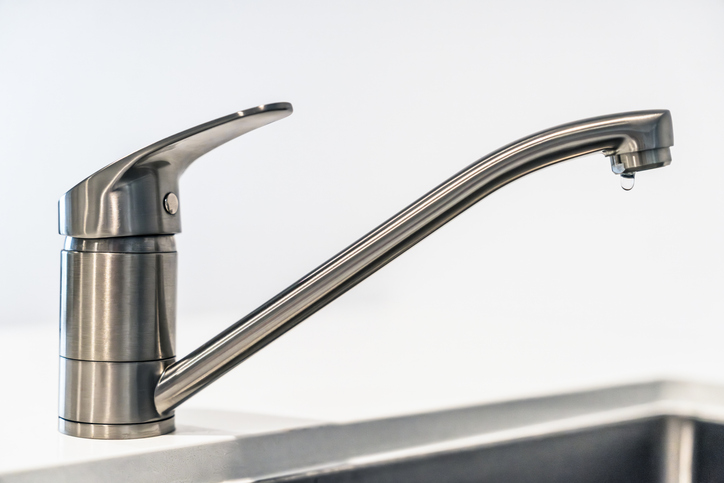 Dripping kitchen faucet side view